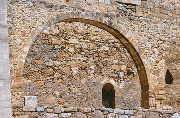 Stone ruins on the Greek aqueduct on island of Crete .