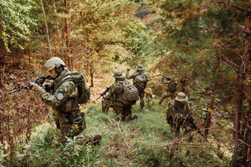 a group of military intelligence in the woods leads