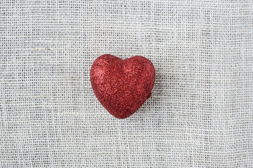 Red Heart on Burlap Background