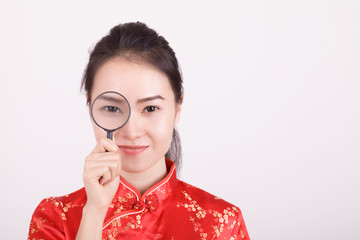 woman holding magnifying glass