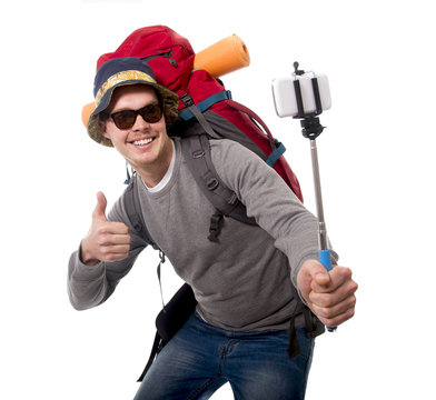 young traveler backpacker taking selfie photo with stick