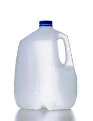 Plastic jug, recyclable and reusable bottle jug container for water, milk and other liquids with no tag and drops on the surface, isolated on white background with reflection - 77242799