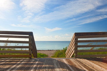Wooden deck with fence overlooking the ocean