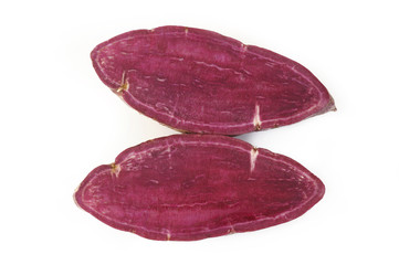 Obraz premium Purple sweet potatoes on white background