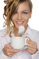 woman with tea bag in your mouth and cup