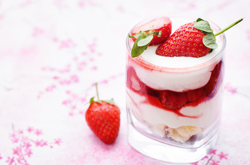 layered dessert with strawberries, biscuit cake and cream cheese