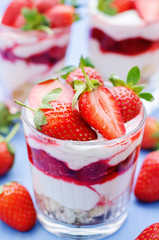 layered dessert with strawberries, biscuit cake and cream cheese