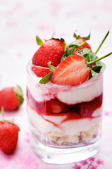 layered dessert with strawberries, biscuit cake and cream cheese