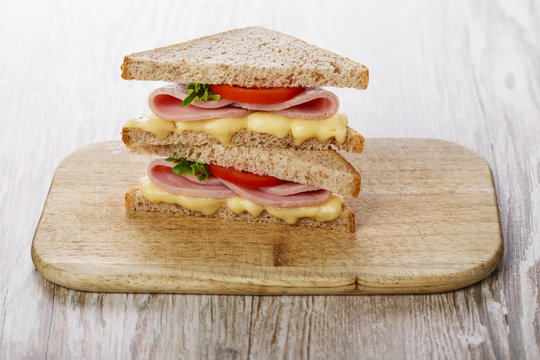 toast sandwich with ham cheese and tomato