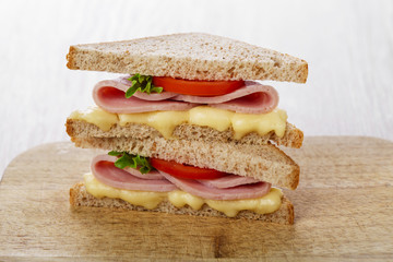 toast sandwich with ham cheese and tomato