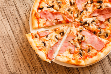 pizza on wooden background