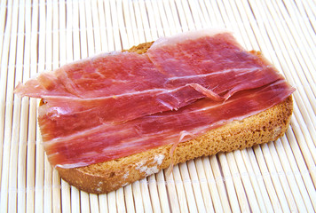 Serrano ham on toasted bread. Jabugo. Spanish tapa.