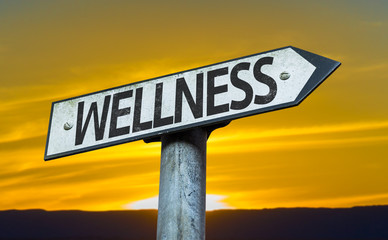 Wellness sign with a sunset background