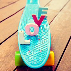 word love on the blue penny board
