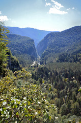 View of the valley and the mountain road along the river Yupsher