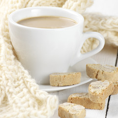 Coffee with cookies and knitwear