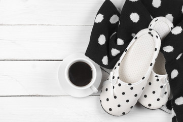Feminine slippers, knitwear and coffee