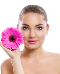 Beauty face of the young beautiful woman with flower