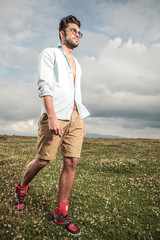 young man walking outside