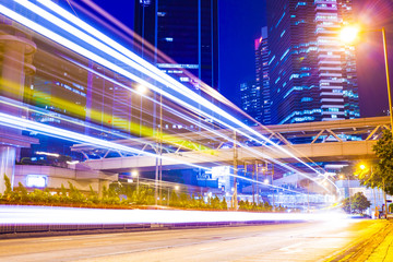 traffic light trails at modern city street,hongkong.