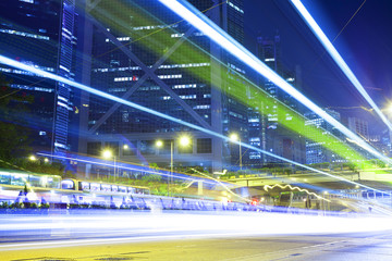 traffic light trails at modern city street,hongkong.