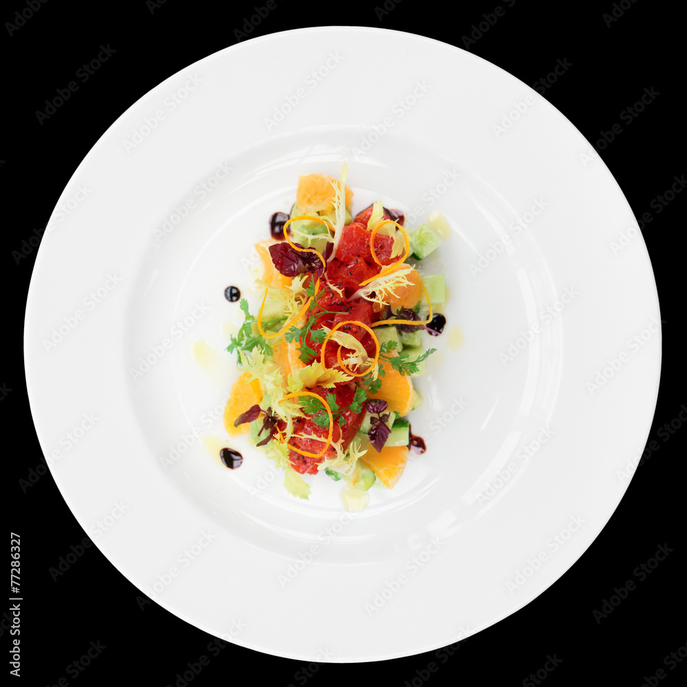 Wall mural Tuna tartar with cucumber and orange, isolated