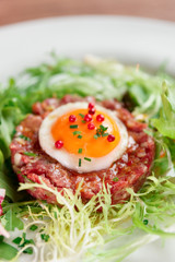 Beef tartare in plate, close-up