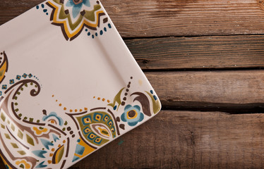 Vintage wooden table with rustic empty plate