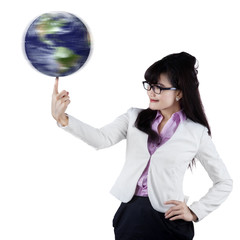 Businesswoman with globe on finger 1