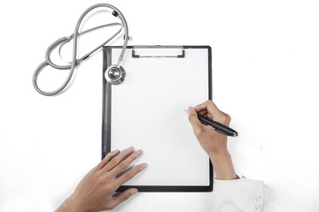 Closeup of doctor writing on blank paper