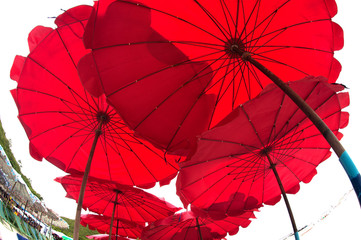 Fototapeta na wymiar Red umbrella on the beach.