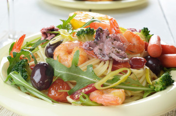 Seafood spaghetti pasta dish with octopus and shrimps