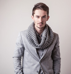 Fototapeta premium Elegant young handsome man in grey costume. 