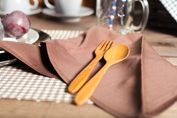 Wooden spoon and fork Placed on the napkin.