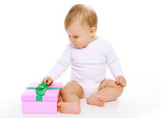 Cute baby sitting with gift box
