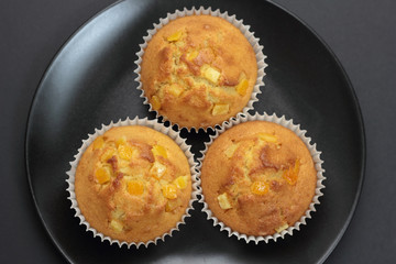Muffins with orange zest just taken from the oven.