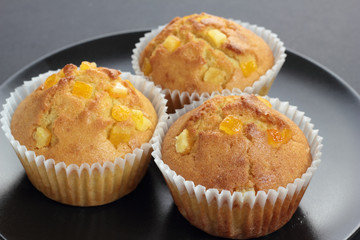 Muffins with orange zest just taken from the oven.