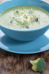 Broccoli puree soup with pupkin seeds and sprouts.