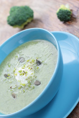 Broccoli puree soup with pupkin seeds and sprouts.