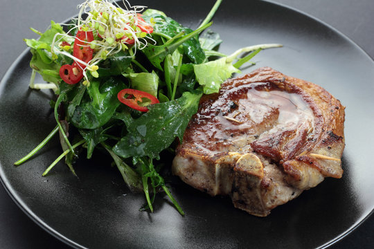 Roasted lamb with rocket, lettuce, sprout and chili salad.