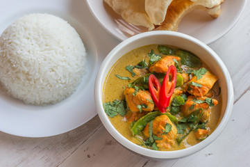 Indian green curry with basmati rice and papadums