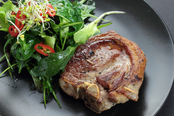 Roasted lamb with rocket, lettuce, sprout and chili salad.