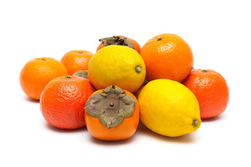 tangerines, lemons and persimmons isolated on white background c