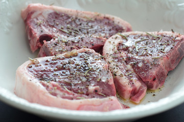 Three pieces of perfectly seasoned lamb meat.