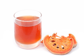 Bael fruit and juice isolated on the white background