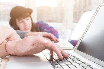 Fototapeta premium Young group of people doing business plans on laptops.