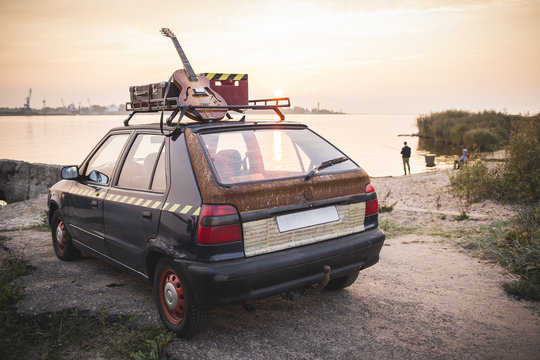 Old Rusted Hippie Car Freedom Concept On Coast