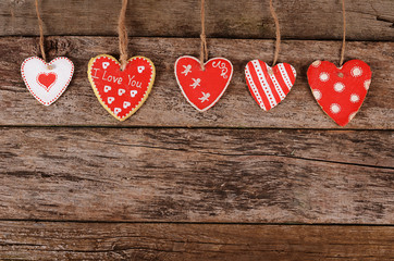 Hearts on wooden background. Valentine's day