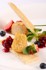 Cheese in breadcrumbs with currant jam