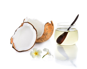 coconut oil with piece of coconut and white flower isolated on w